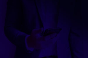 business man holding his phone