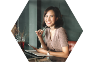 woman smiling while taking online courses
